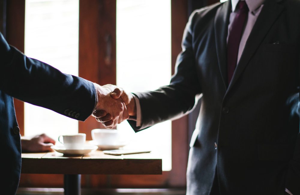 agreement-collaboration-cooperation-1645693 Two Men Shaking Hands